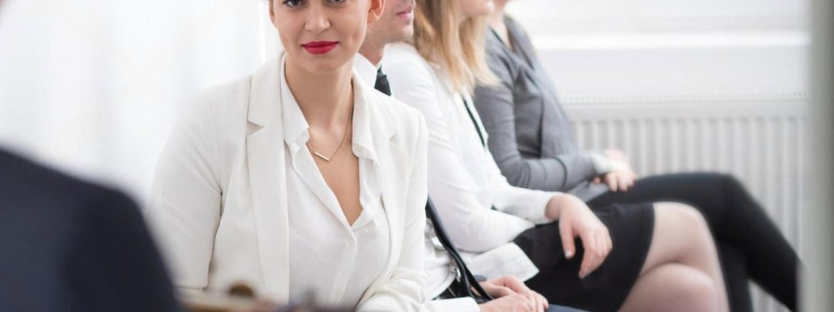 Clients seated in a row waiting for a specialist in a UAE office
